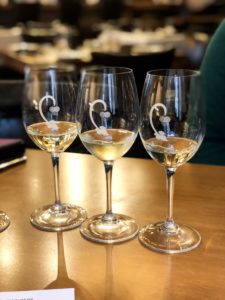 Three glasses of white wines that is part of a wine flight at Cru Food and Wine Bar