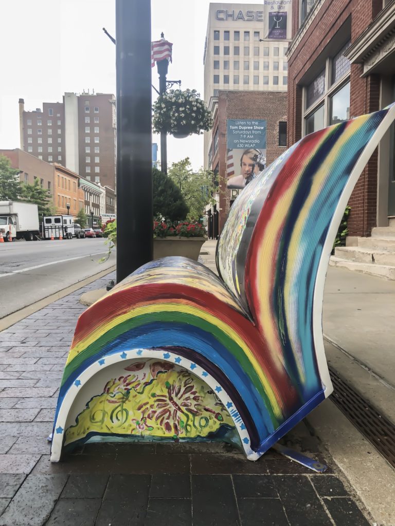 In the summer of 2018, Arts Connect, LexArts and The Carnegie Center for Literacy and Learning has made Lexington more colorful with their collaborative project, Book Benches.​ Book Benches are thirty five book-shaped functional benches that are placed throughout downtown Lexington to celebrate Kentucky's literary heritage, to encourage reading, and provide a place for rest. Each bench is illustrated and themed around different works by Kentucky authors and will remain on display for the duration of the summer. #sharethelex #art #painting #artist #author #book #lexingtonky #kentucky #visitlex #bench