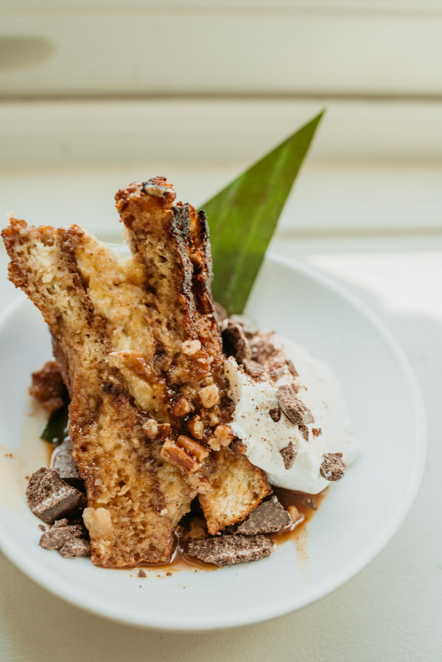 Roasted Banana Dulce de Leche French Toast on a white plate