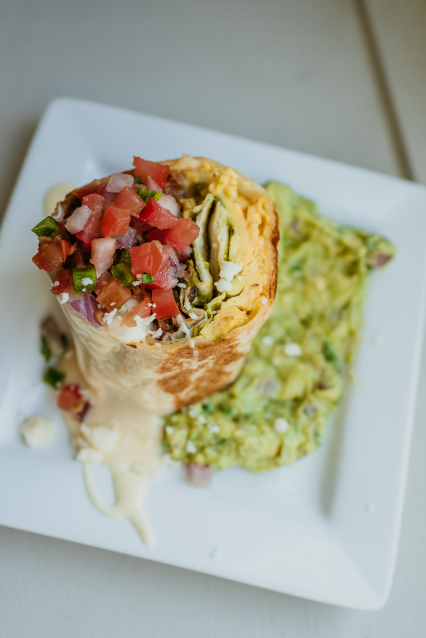 The Brunch Burrito from Corto Lima on a square plate