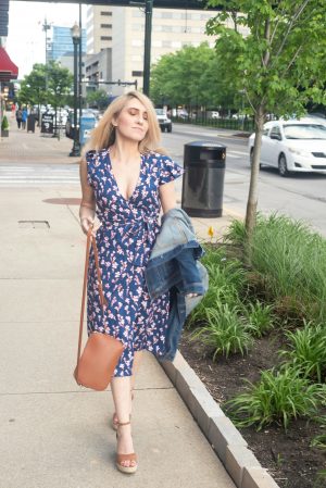 Girl with purse looking down walking