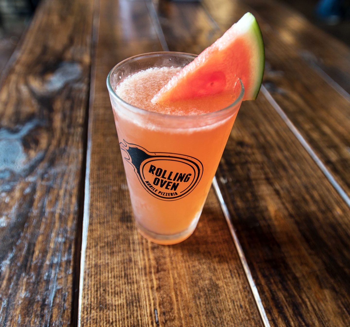 Watermelon beer with a slice of watermelon