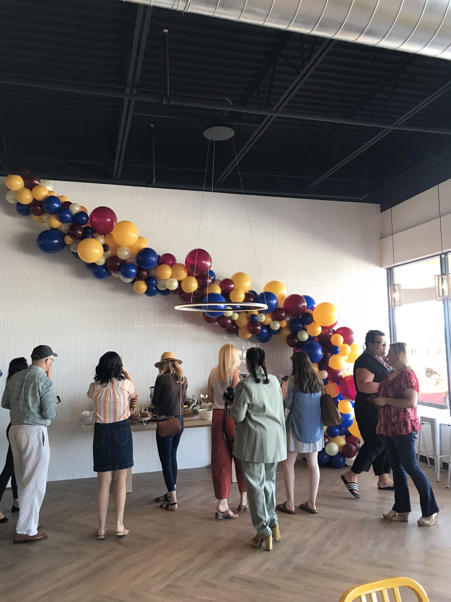 A group of people taking pictures of food