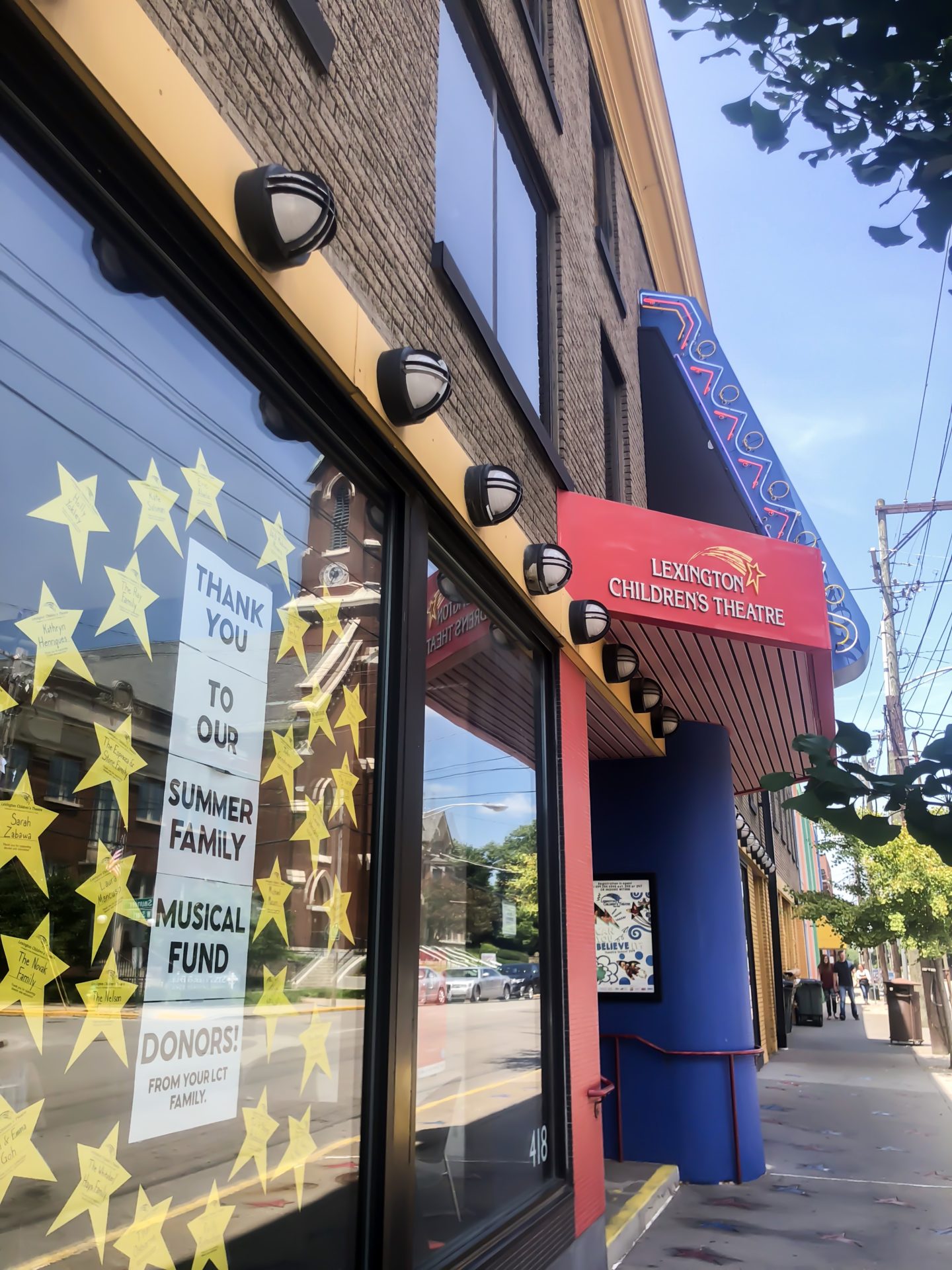 store front with stars and sign that says lexington children's theatre