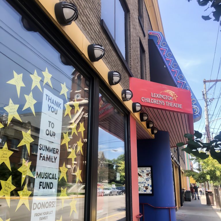 store front with stars and sign that says lexington children's theatre