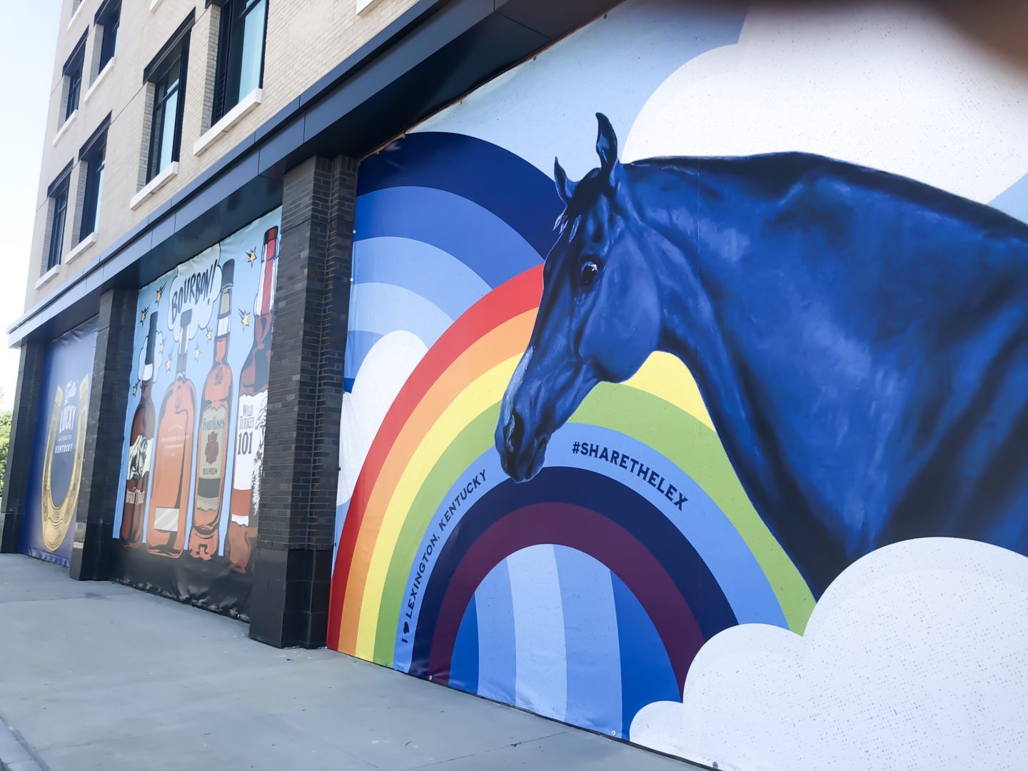 mural of blue horse and rainbow