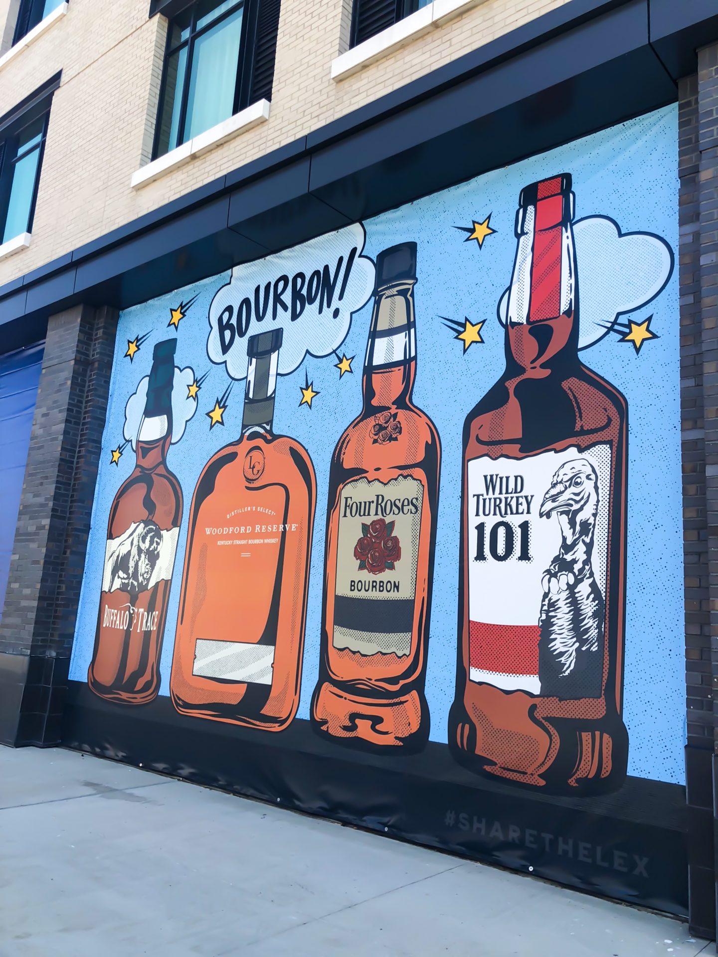 four bottles of bourbon mural