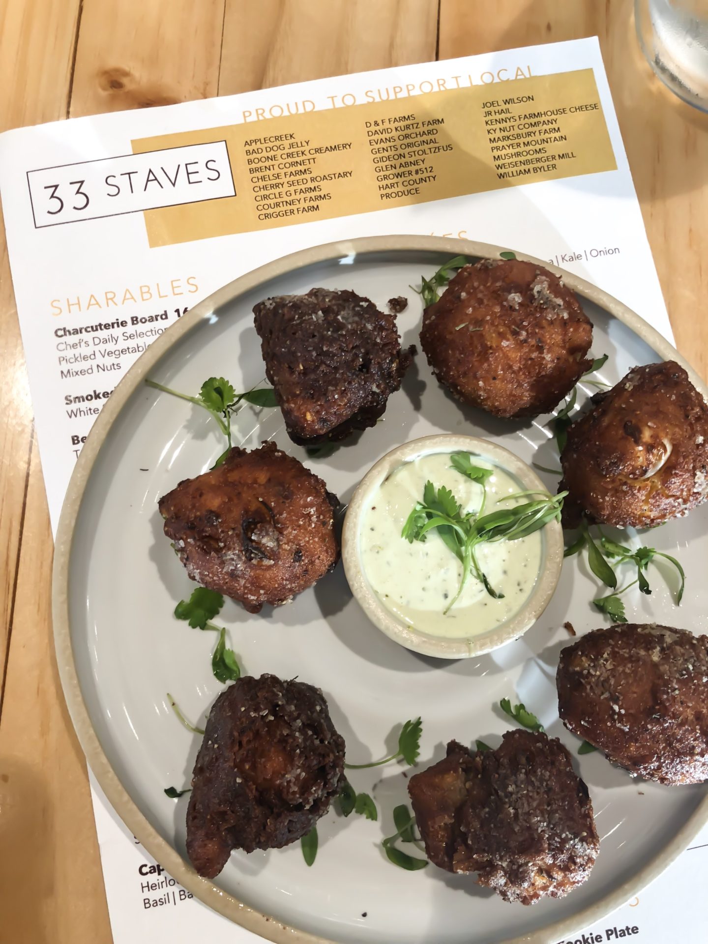 menu with chorizo fritters on a plate