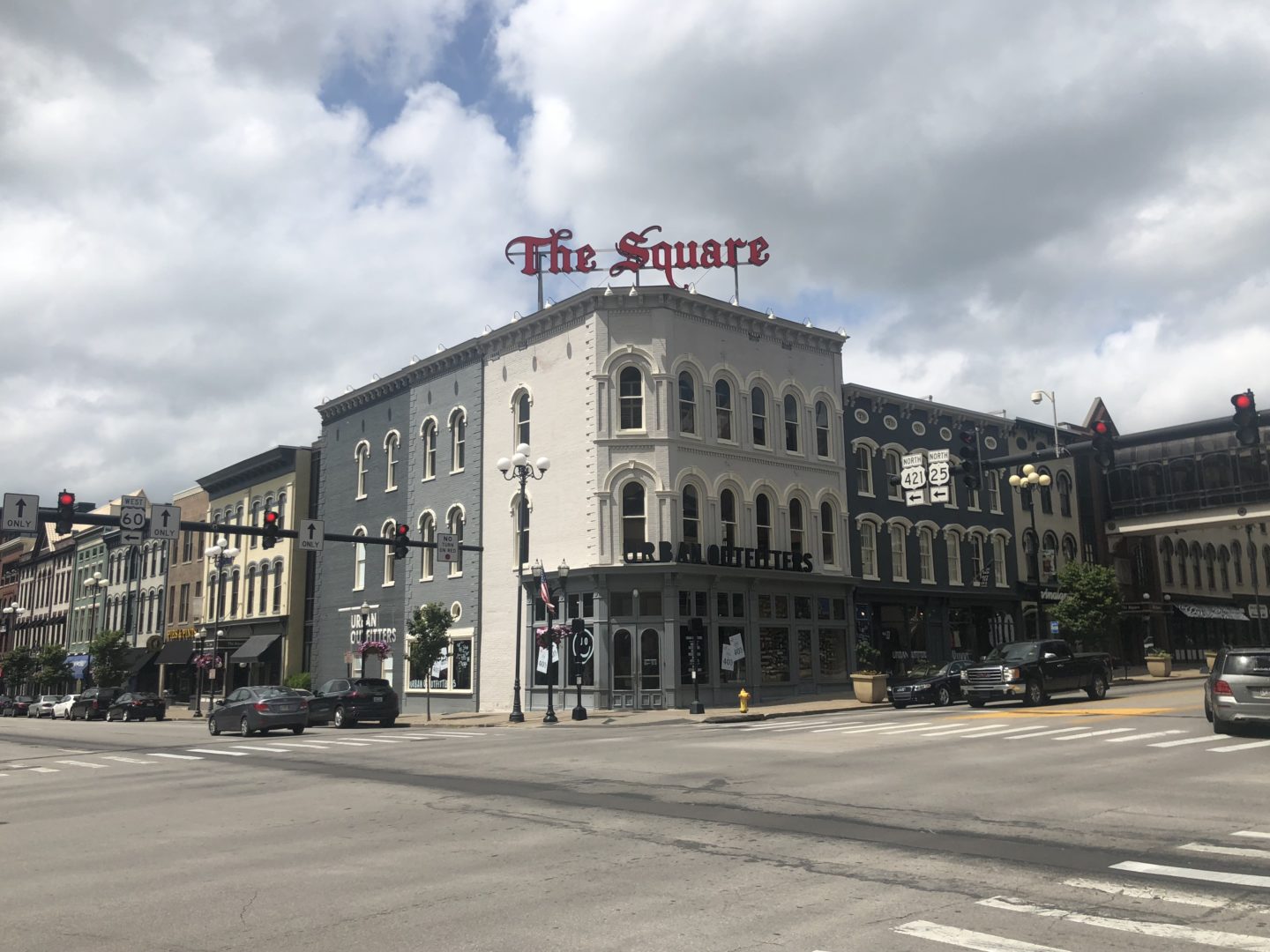 downtown of a city with a sign that says "the square"