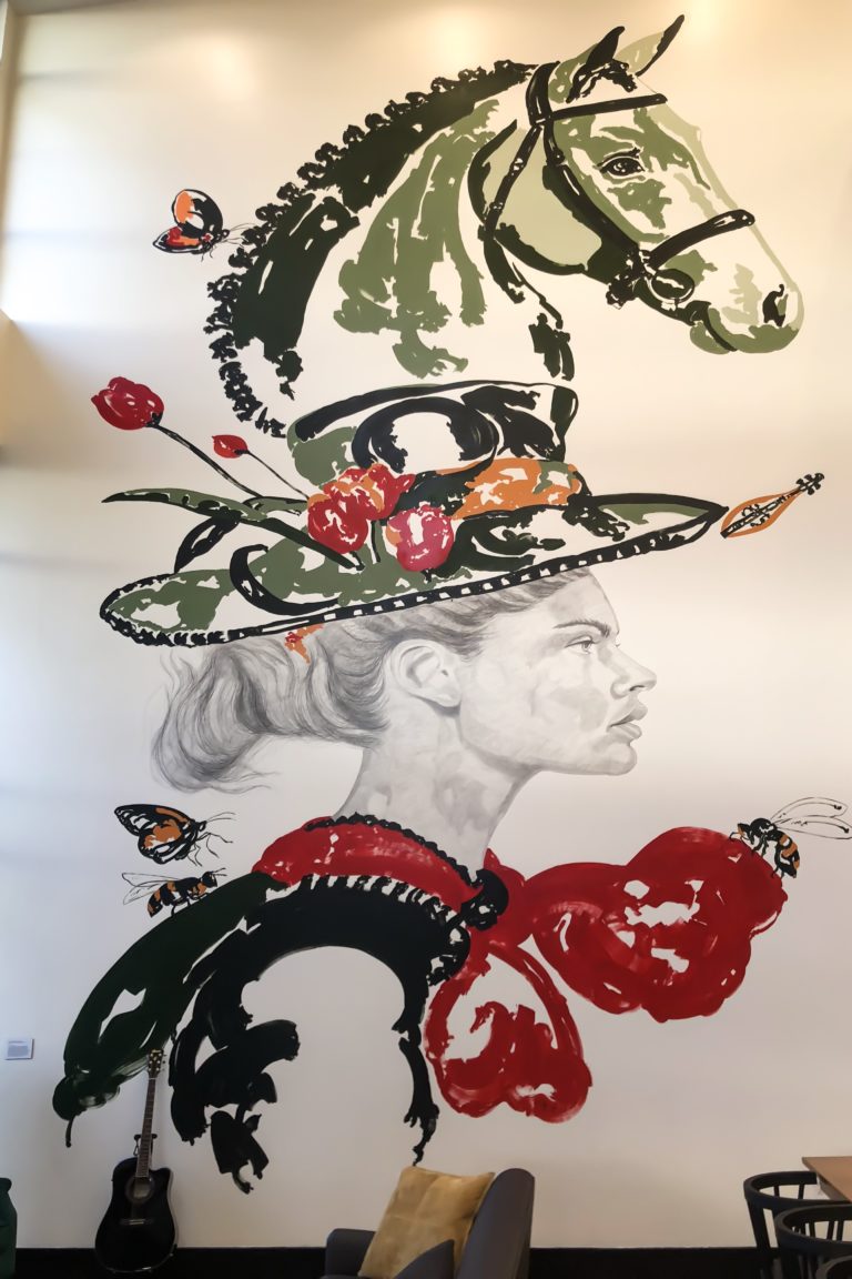 woman with a horse derby hat mural