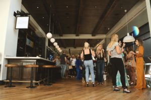 group of people in a hotel lobby bar