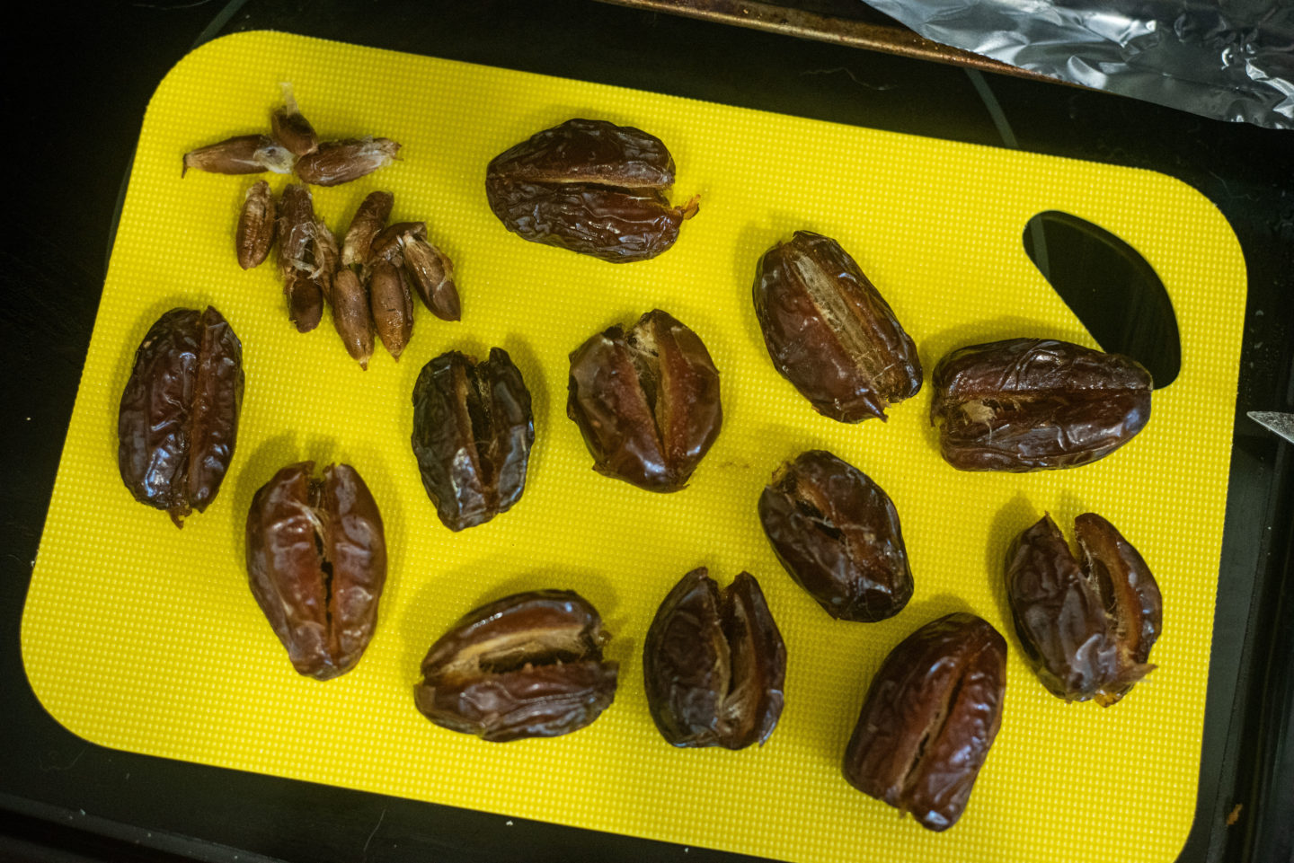 pitted dates on a cutting board