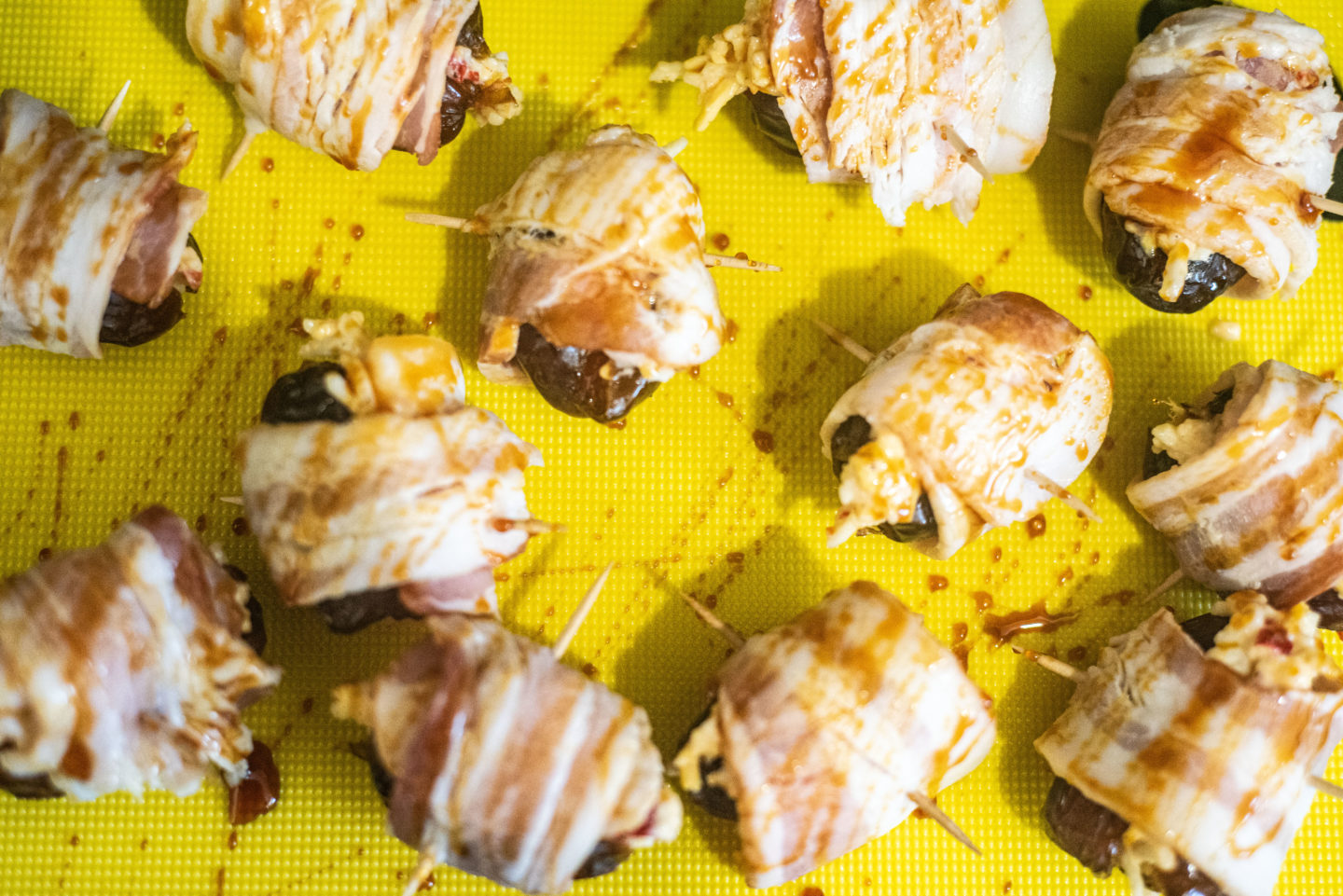 pitted dates wrapped in sorghum drizzled with sorghum