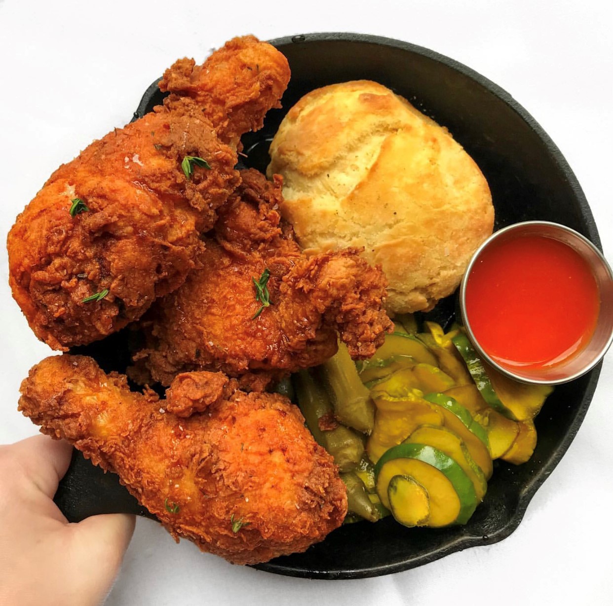 fried chicken and vegetables and a roll