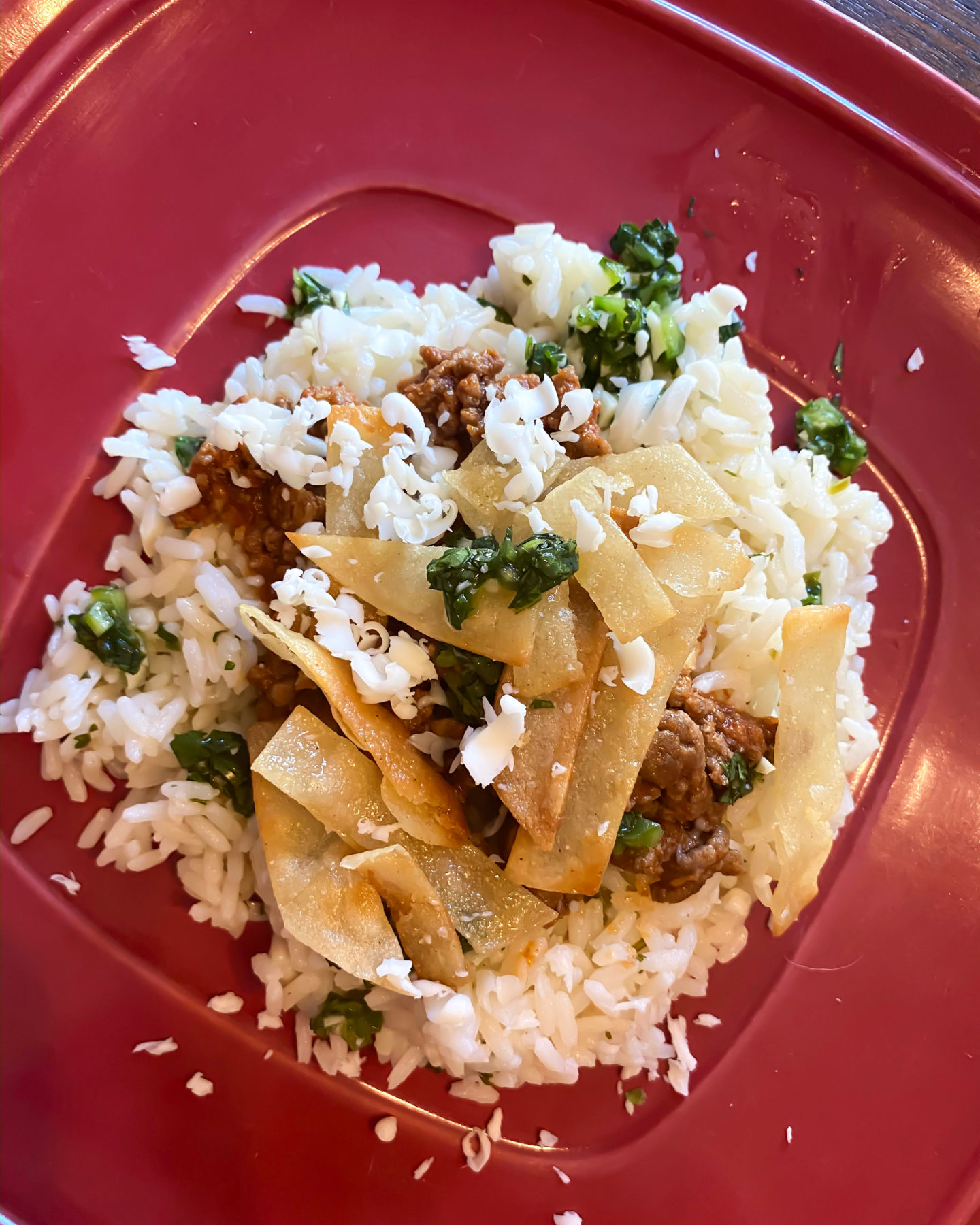 beef taco bowl with rice on a plate