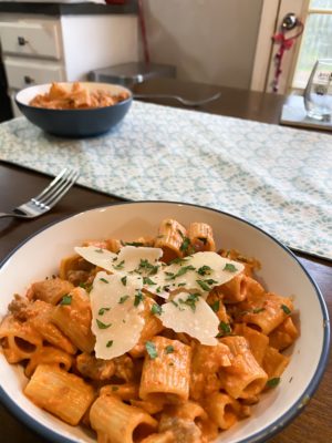 pasta in a vodka cream sauce with cheese on top